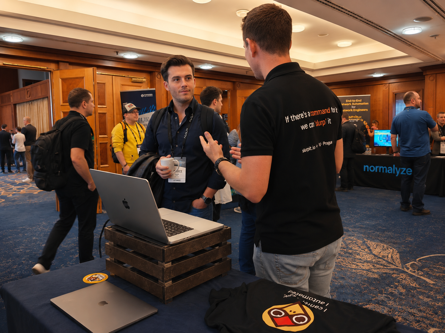Netpicker team speaking with network engineers at an event