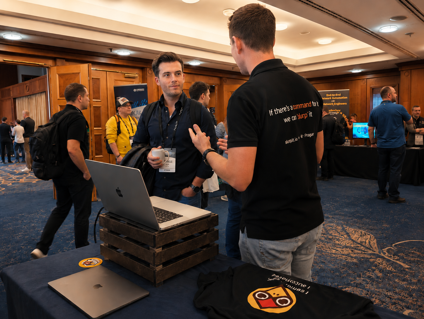 Netpicker team speaking with network engineers at an event